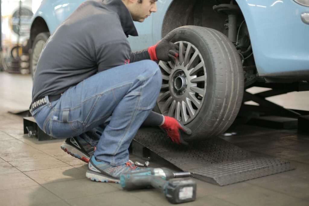 Mechanic performing tyre replacement in Ipswich